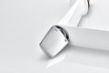 InArt basin tap close-up of single lever handle and smooth white silver finish on brass body