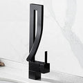 InArt black tap for wash basin installed in modern bathroom interior, single lever basin tap in matt black