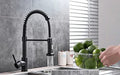 InArt black sink mixer tap close-up of multi-function spray head and pull-down hose for easy rinsing