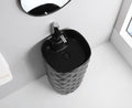 Close-up of matte black ceramic square wash basin rim and pedestal, premium sanitaryware finish detail
