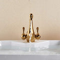 InArt brass basin tap with single hole basin mixer body, gold swan neck spout close-up detail