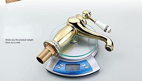 Gold basin tap installed on wash basin, single lever basin mixer for stylish Indian bathroom
