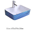 Rectangular table top wash basin in glossy blue ceramic, designer bathroom basin side angle