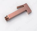 InArt jet spray for washroom in rose gold brass, easy grip hand spray with hose, angled close view