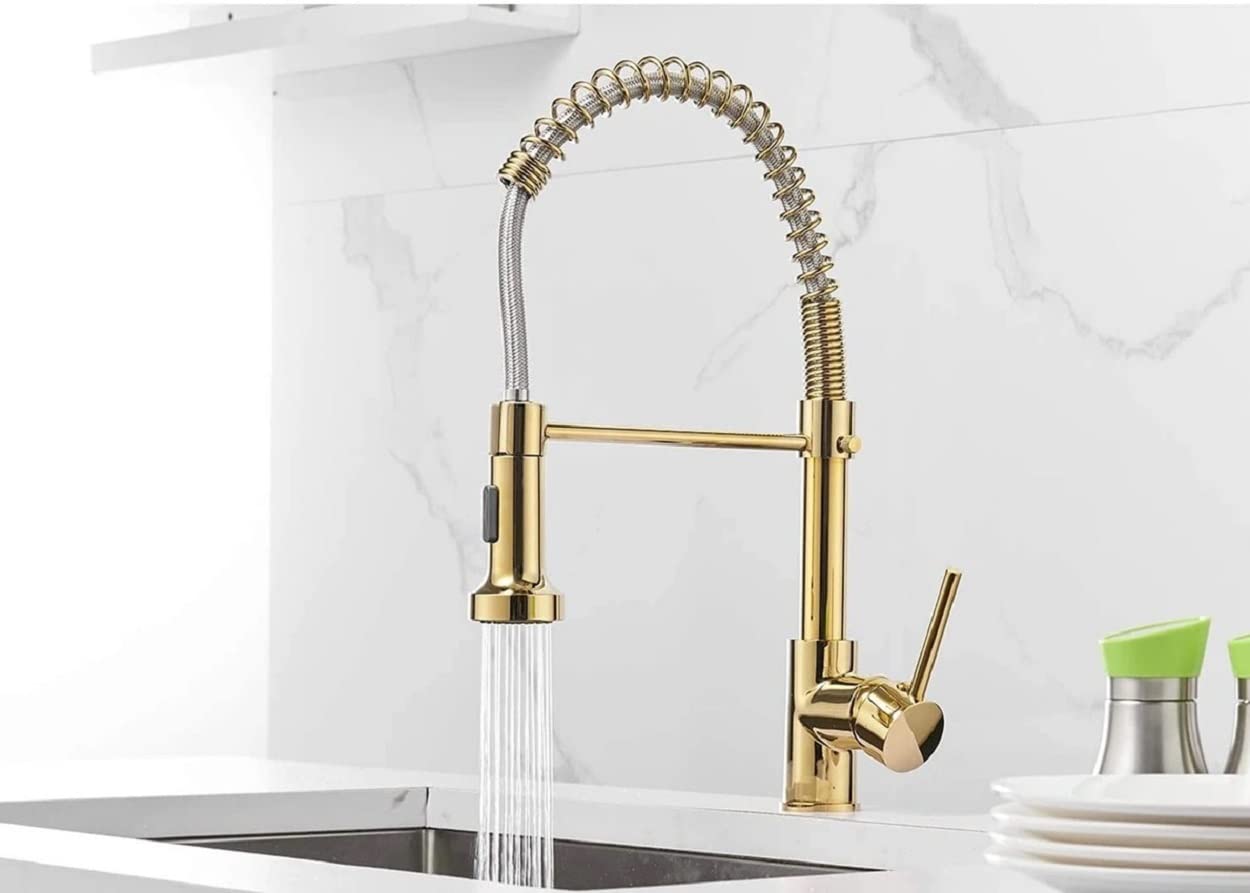 Gold pull out kitchen faucet with spring neck, side angle view of single handle mixer tap