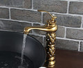 InArt gold mixer tap for bathroom sink, single lever hot and cold basin mixer shown at side angle
