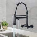 InArt wall mounted kitchen sink tap in brass with matte black finish, pull-down sprayer and single lever