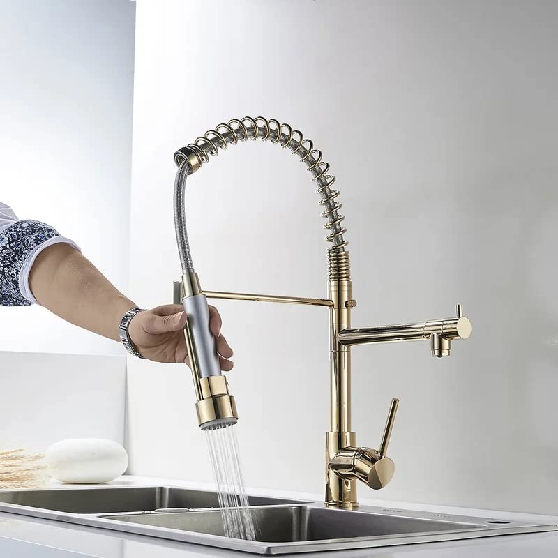 Pull out sink mixer tap close-up of single lever handle and smooth golden finish on brass body