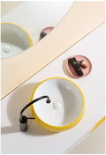InArt table top basin design with cabinet look, glossy yellow square ceramic wash basin for modern washroom