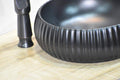 Modern contemporary bathroom sinks: InArt black matt ceramic round wash basin, top angle showing bowl depth