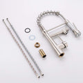 InArt sink mixer tap with pull-down sprayer head and dual flow, angled product view in brushed chrome