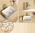 InArt designer washbasindesign rectangular ceramic wash basin, glossy gold white above counter angle view