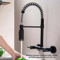 Wall mount kitchen sink faucet in matte black finish with single lever mixer, angled side view