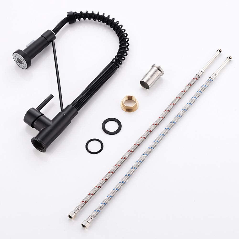 Kitchen sink pull out tap in matte black, pull-down sprayer extended for rinsing in modern kitchen