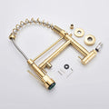 InArt kitchen faucet with sprayer, close-up of multi-function spray head and pull-down hose in gold