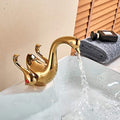 Single lever wash basin mixer in gold finish, swan neck basin tap shown at right side angle