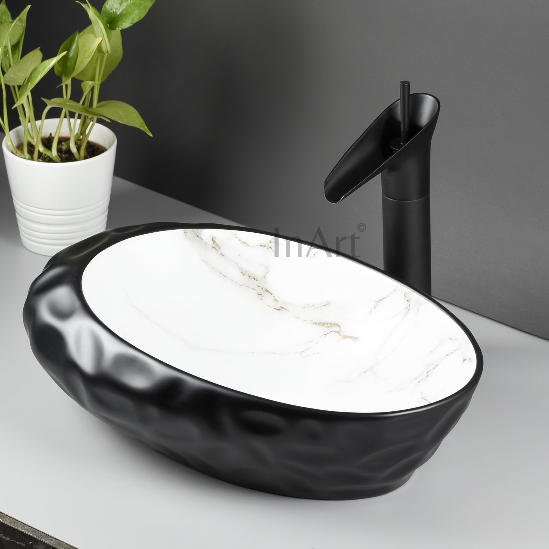 InArt trendy matte black wash basin for bathroom or livingroom decor, oval ceramic counter top basin close-up