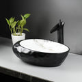 Modern washing basin design by InArt, oval ceramic table top wash basin in matt black marble, top view