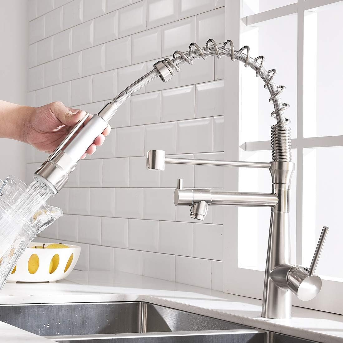 Close-up of InArt tap mixer showing dual flow spray modes and brushed chrome finish
