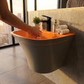 Close-up of slim rim on premium ceramic wash basin, orange grey matt satin finish sanitaryware