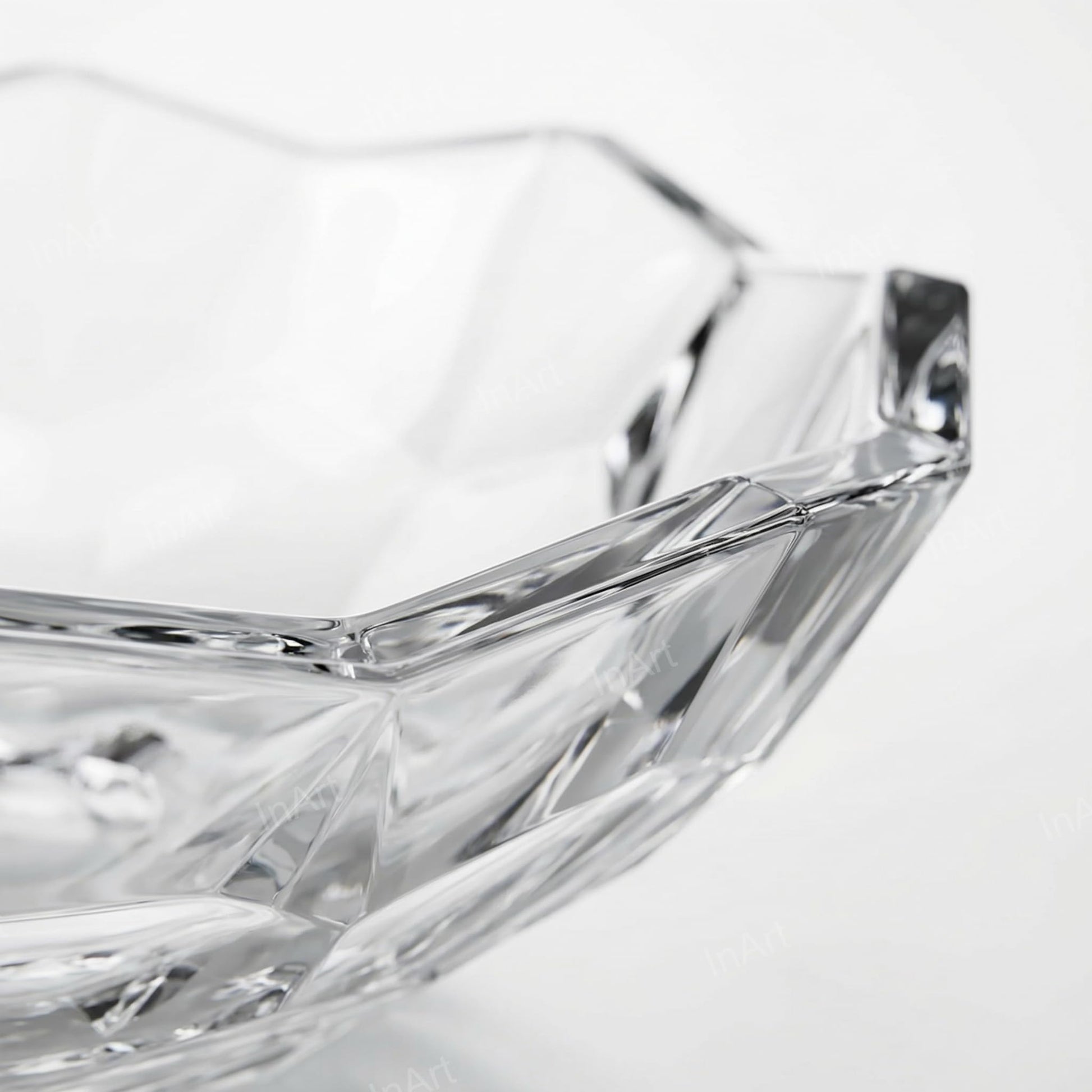 Transparent glass wash basin close-up of geometric PrismCut pattern, premium clear glass finish detail