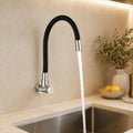 Detail of brushed stainless steel finish on wall mounted kitchen tap body