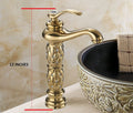 InArt brass bathroom sink tap in golden colour, single hole basin mixer tap close-up of handle and spout