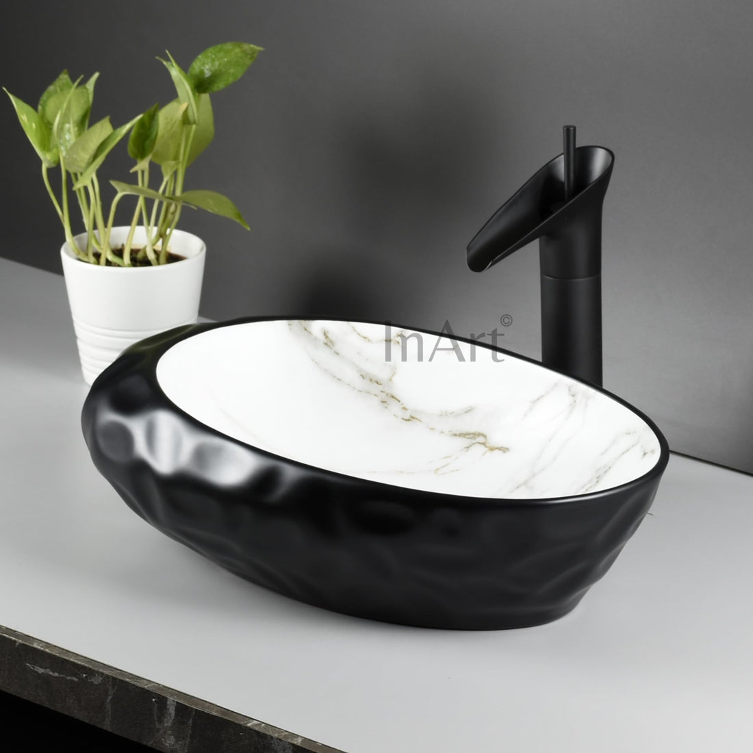 InArt contemporary wash basin, matte ceramic oval table top basin in black and white marble finish
