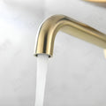 Brushed gold waterfall wall mounted basin mixer tap, side angle view for modern wash basin mixer taps