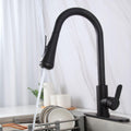 Detail of high arc spring neck and retractable hose on InArt kitchen sink pull out faucet, black finish