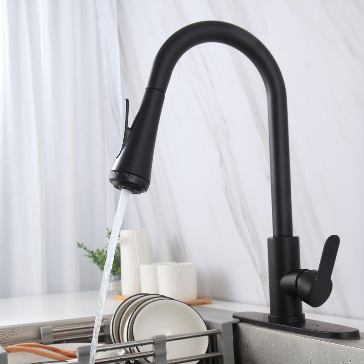 Detail of high arc spring neck and retractable hose on InArt kitchen sink pull out faucet, black finish