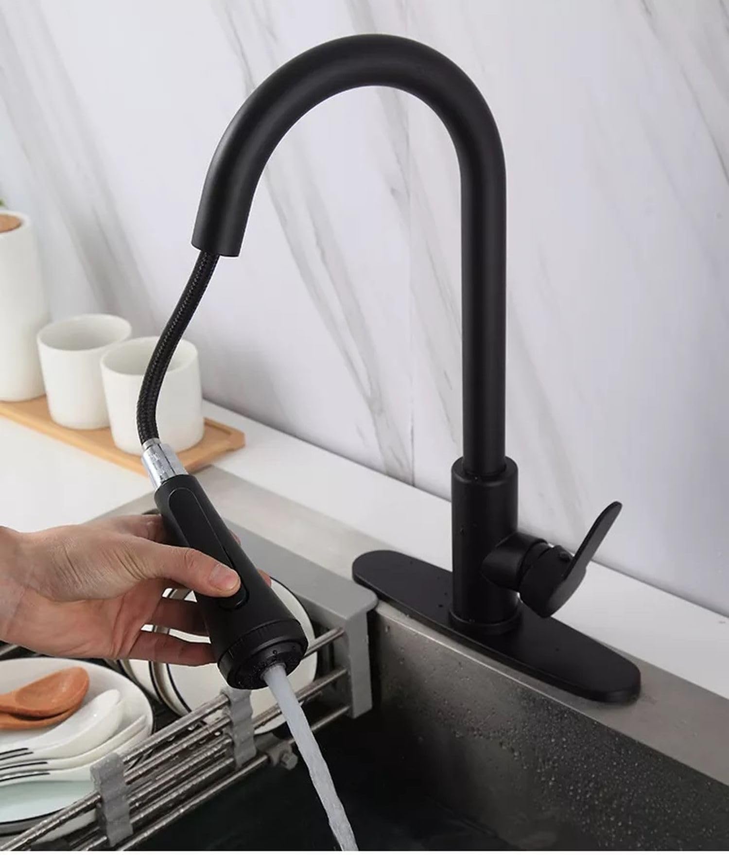 InArt black tap for kitchen sink showing swivel spout movement and pull out hose, functional view