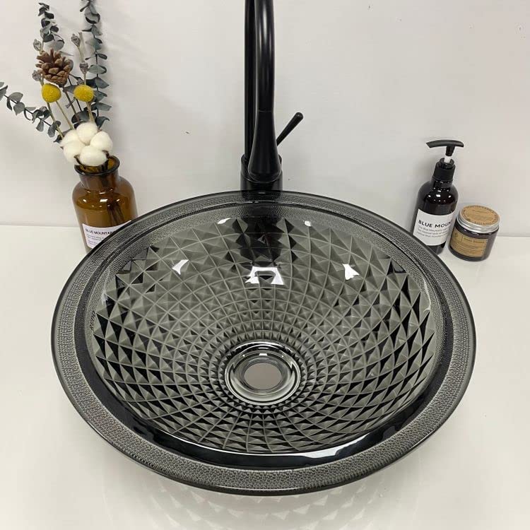 Black tempered glass wash basin table top installed on vanity, modern bathroom interior with tap