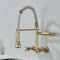 Gold wall mount kitchen sink faucet with pull down sprayer, side angle view for modern Indian kitchens