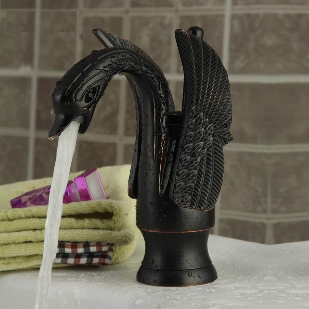 Matte brass swan neck basin tap, side angle view for modern bathroom wash basin