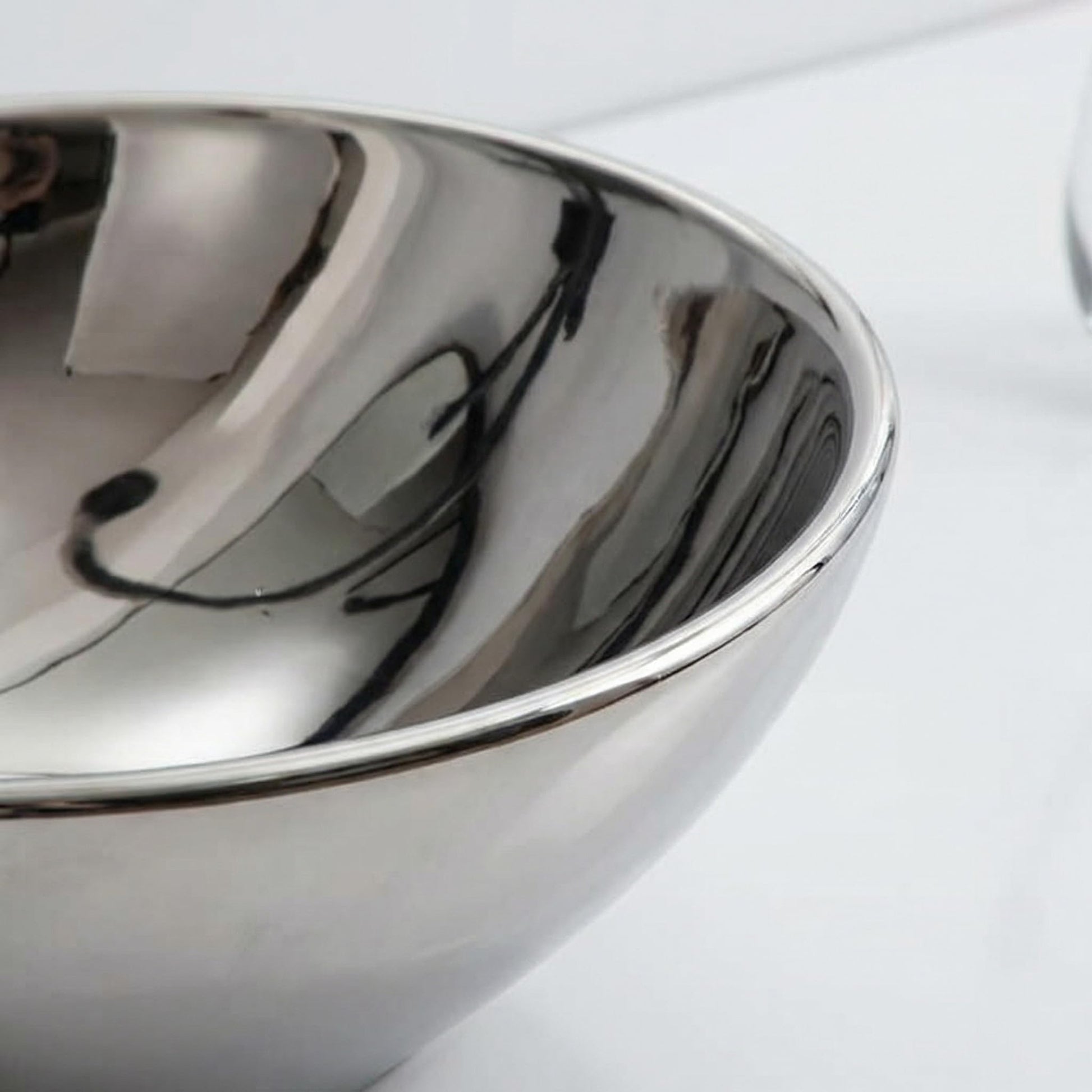 InArt premium sanitaryware table top wash basin designs for dining room, silver oval basin close-up of glossy finish