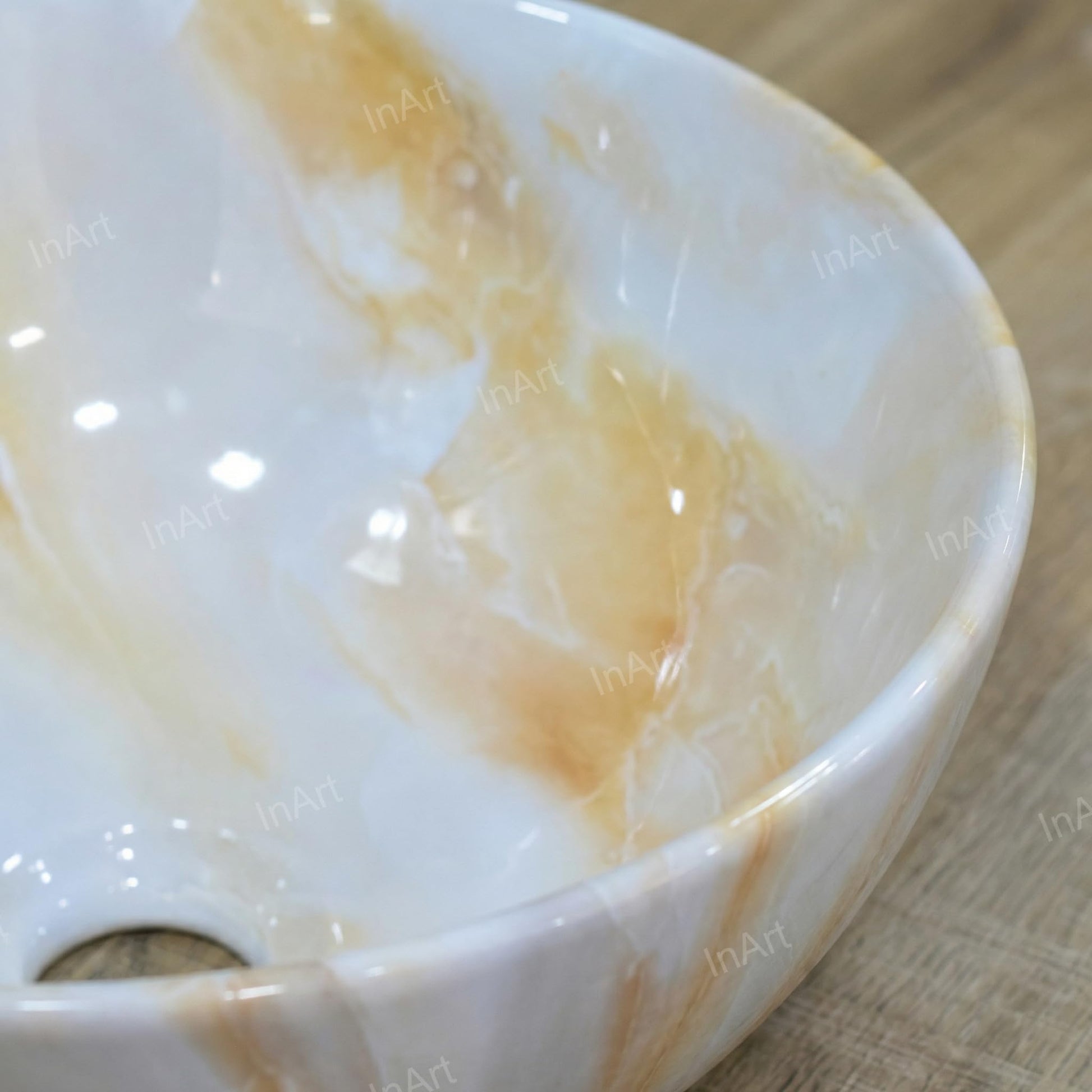 Table top wash basin with cabinet pairing idea, round glossy onyx basin on counter in bathroom
