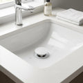 InArt white matte waste coupling for wash basin with easy press pop up mechanism, close-up detail