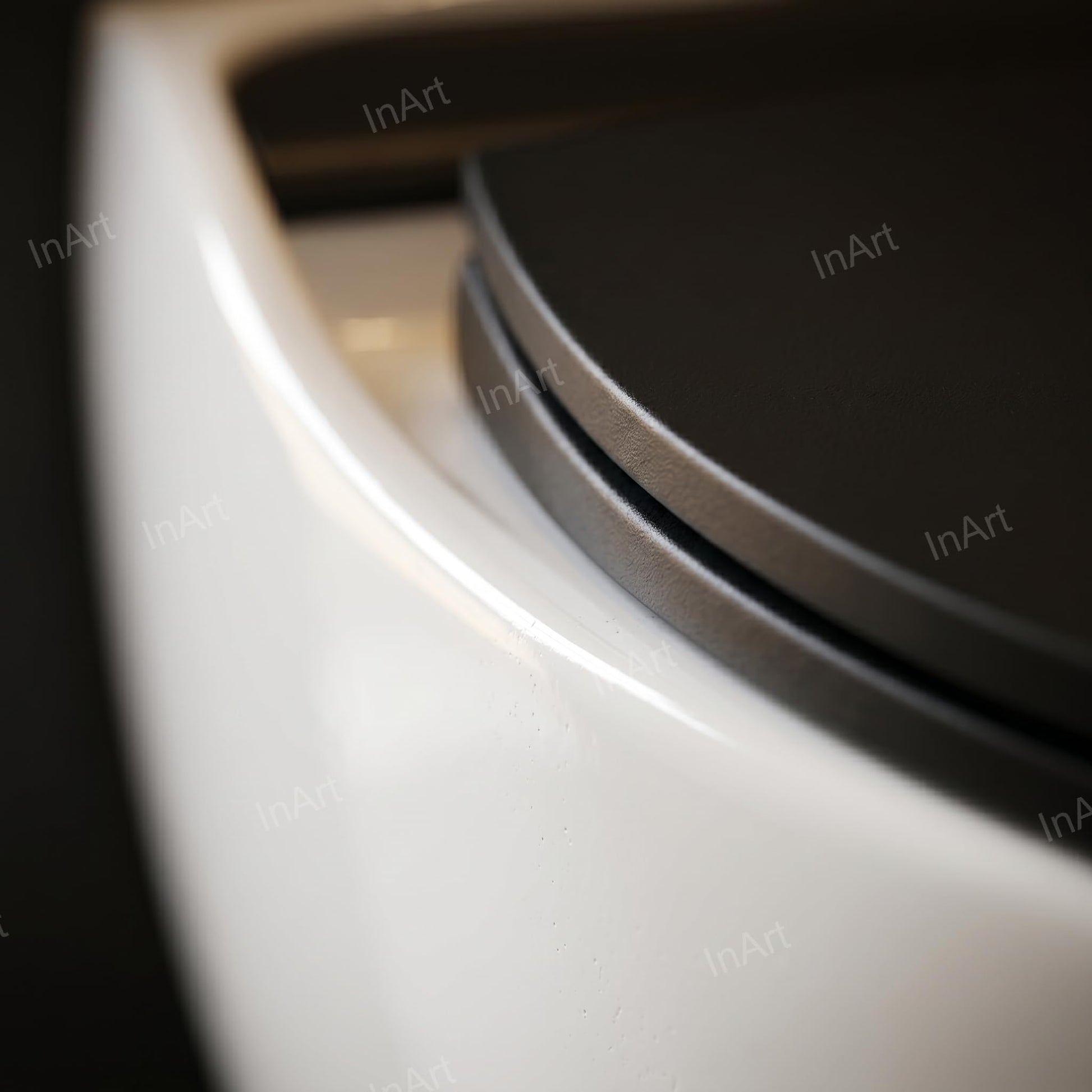 InArt wall hung western toilet in black and white, space-saving commode for compact washroom setup