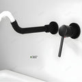 Detail of waterfall basin tap outlet in matte black, smooth water flow design for wash basin in bathroom