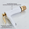 Bathroom mixer tap styling shot with golden white basin tap on washroom counter, modern interior