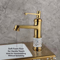 Gold finish single lever basin mixer tap, angled view showing waterfall spout for modern bathroom wash basin