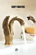 Close-up of InArt brass basin mixer tap handle and spout, antique gold wash basin tap hot and cold