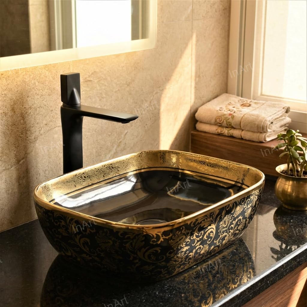 InArt premium sanitaryware oval ceramic counter type wash basin with glossy black and gold finish, rim detail