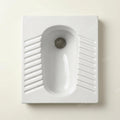 Top view of rectangular squat toilet pan with smooth white glazed ceramic surface