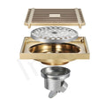 Close-up of InArt antique brass floor drain jali, easy-clean removable cockroach trap for bathroom floor