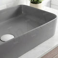 Rectangular tabletop washbasin on bathroom counter, matt grey ceramic basin with tap hole, modern washroom look