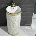 Designer pedestal wash basin in glossy white and gold, round ceramic basin with pedestal, 3/4 angle view