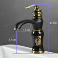 Black gold glossy wash basin mixer tap, single lever basin mixer with waterfall spout, angled view for modern bathroom