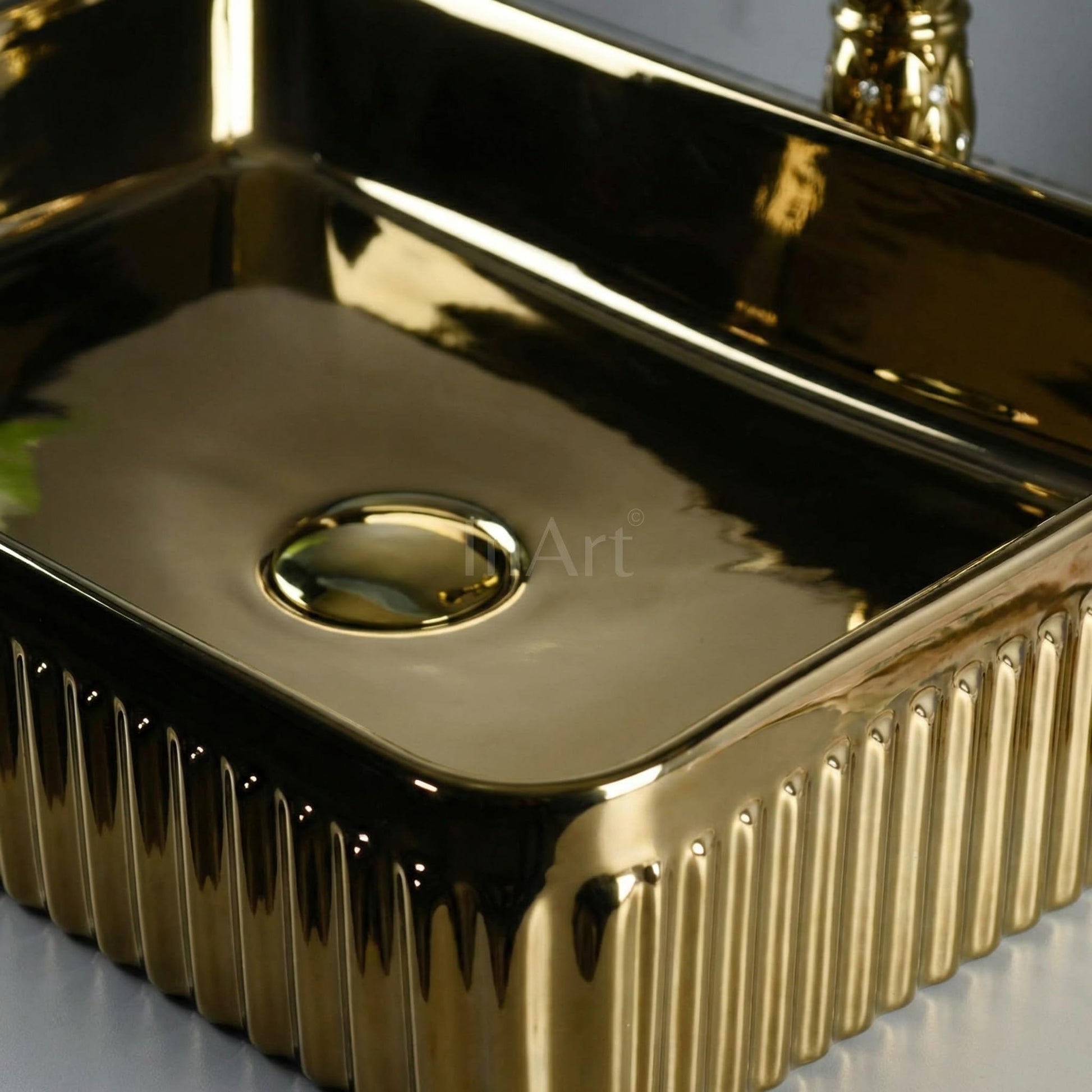 InArt table top wash basin with cabinet style setup, rose gold rectangular ceramic basin on vanity in washroom